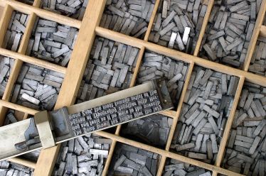 Metal movable type similar to what the printer may have used to make the invitations (Source: Wikipedia)