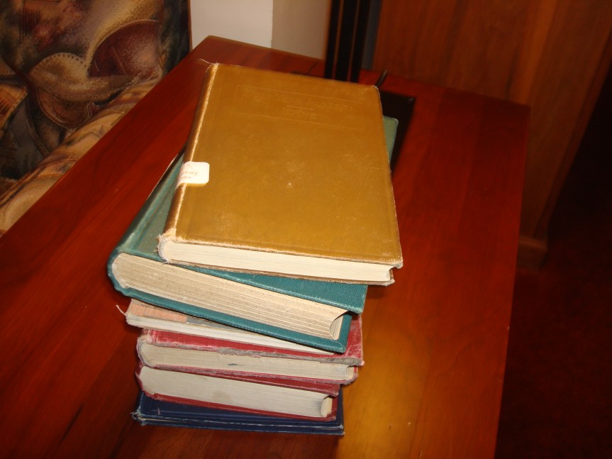 Pile of hundred-year-old textbooks waiting for me to return them to the library