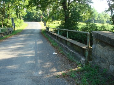 Road near the Muffly farm.  How farm did the boy need to walk to get home? 