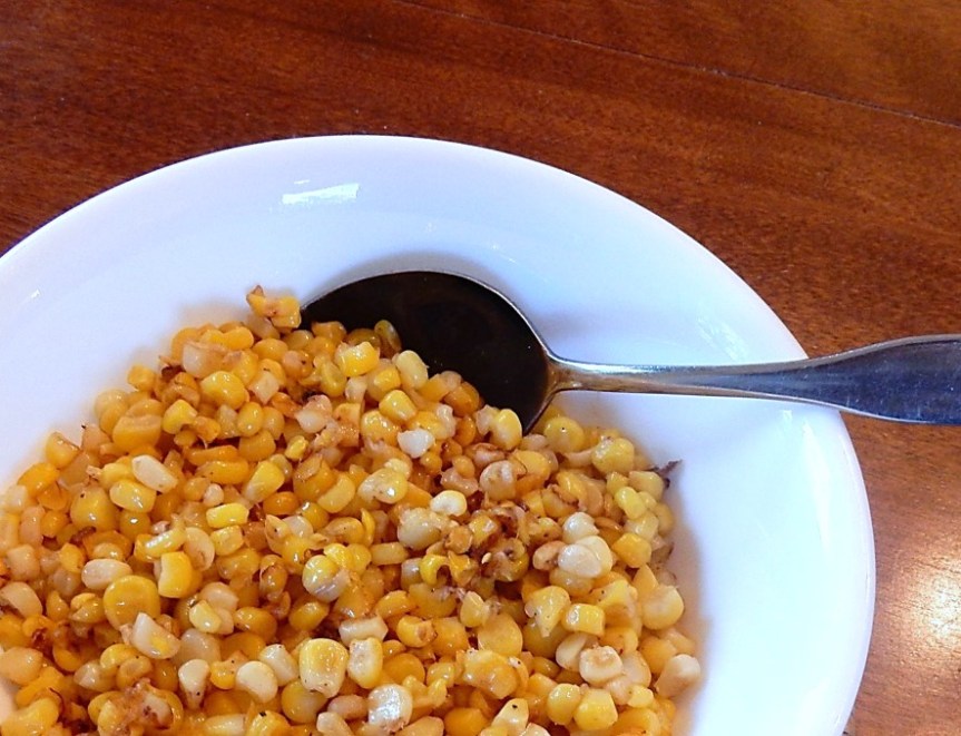 fried corn in bowl with spoon