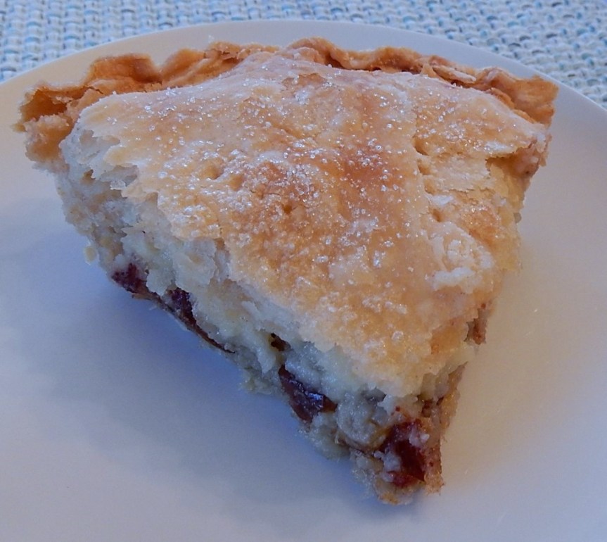 slice of sour cream pie with dates on plate