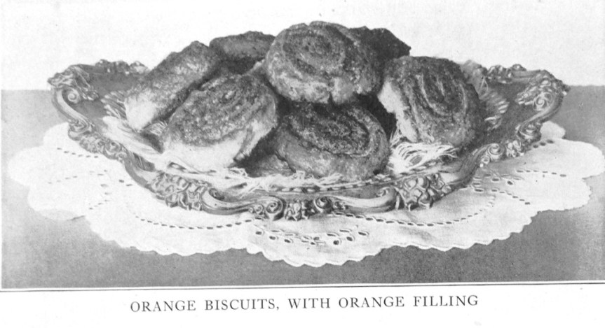 orange biscuits with orange filling on plate