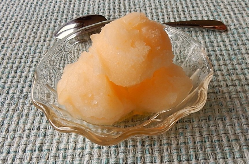 dish with scoops of canned apricot sherbet