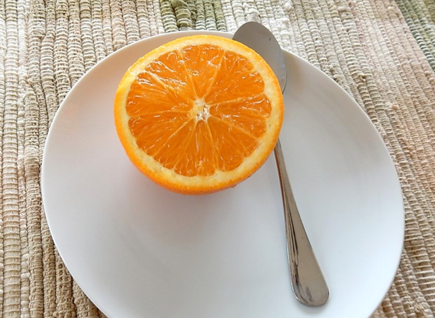 orange half on plate