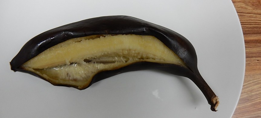 Baked banana on plate