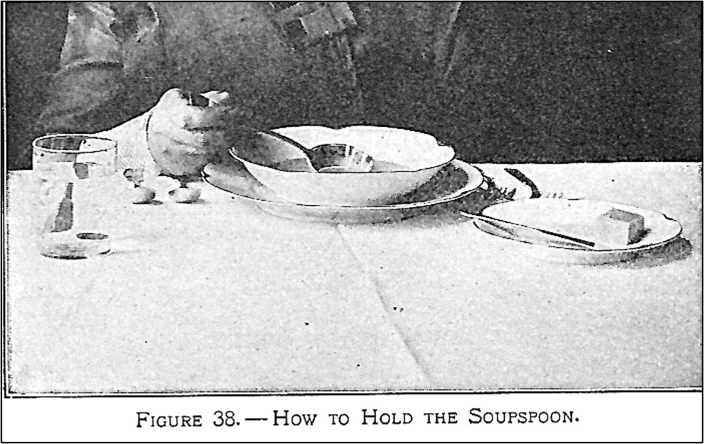 scooping soup out of a bowl with a soup spoon