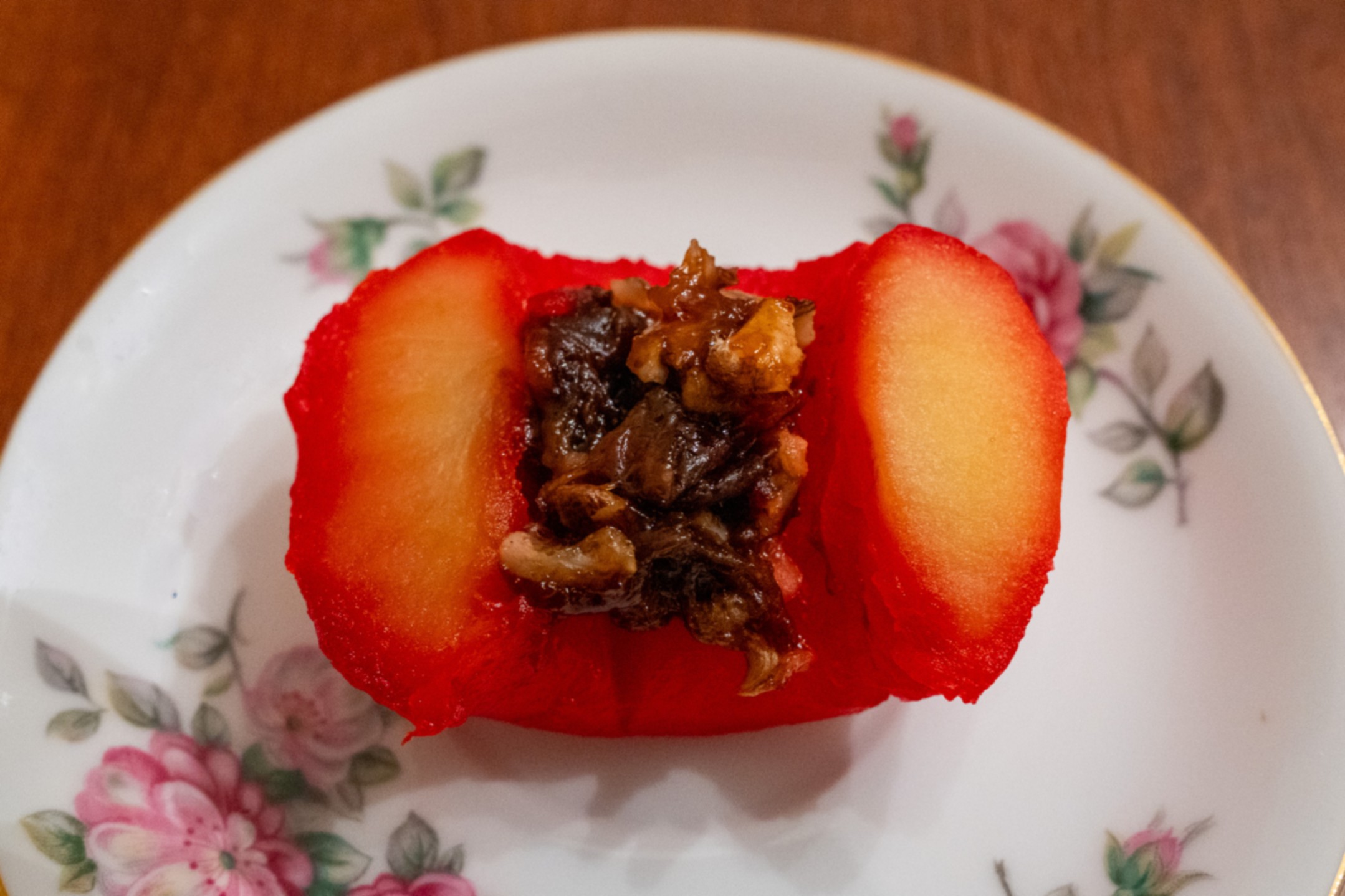 Stuffed apple half on plate