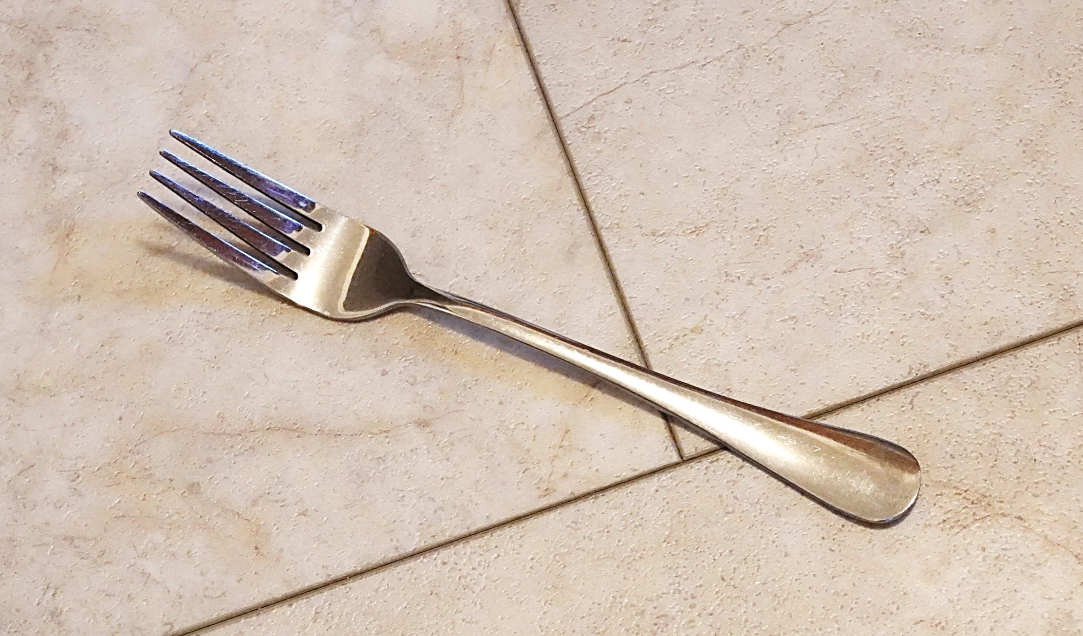 A fork lying on the floor
